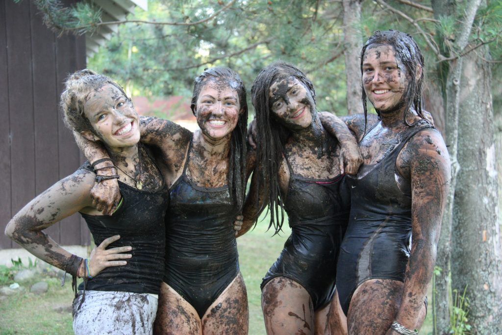 Teenagers engaging in outdoor activities at summer camp