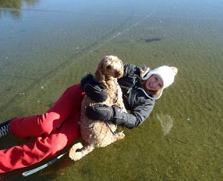 Kylie And Dog "Nike" Laying On Ice